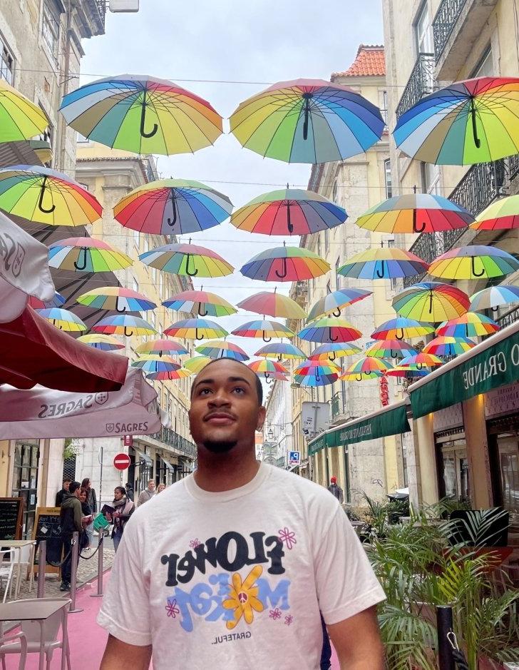 Quentin Jenkins stands under umbrellas in England. 